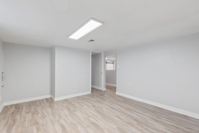 unfurnished room featuring light hardwood / wood-style floors