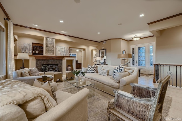 living room with light tile patterned floors, recessed lighting, visible vents, a high end fireplace, and crown molding