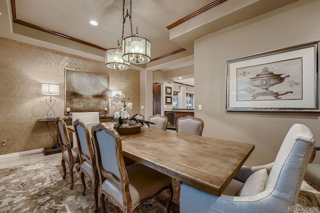 dining room with a textured wall, ornamental molding, and recessed lighting