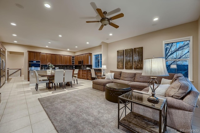 living area with light tile patterned floors and recessed lighting