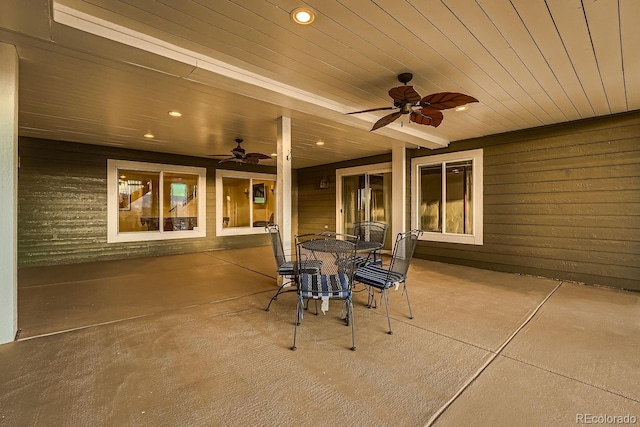 view of patio featuring a ceiling fan and outdoor dining space