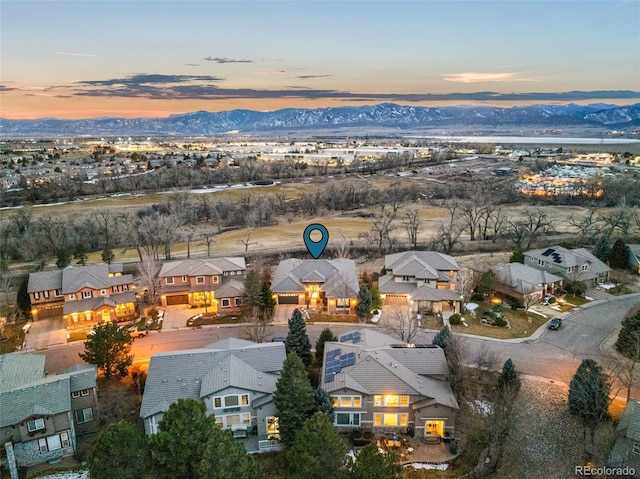 aerial view at dusk with a residential view and a mountain view