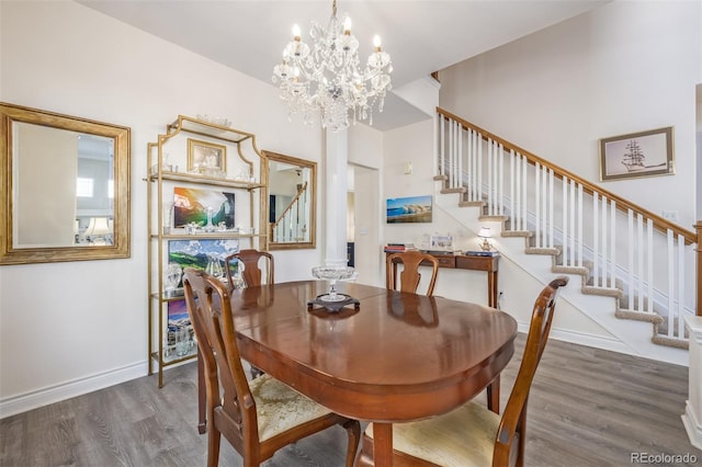 dining area featuring a chandelier and dark wood-type flooring