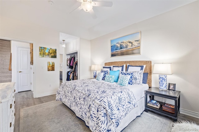 bedroom with ceiling fan, a closet, and light hardwood / wood-style flooring