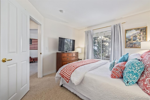 bedroom featuring light colored carpet