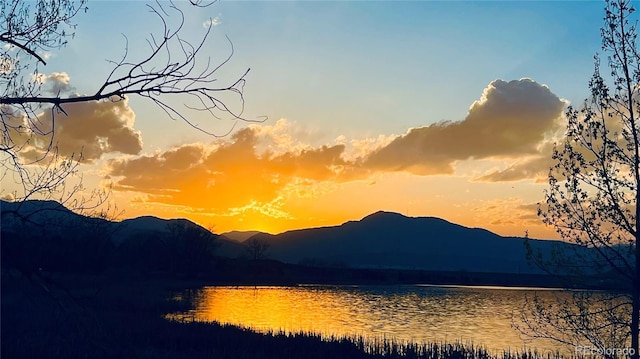 view of mountain feature with a water view