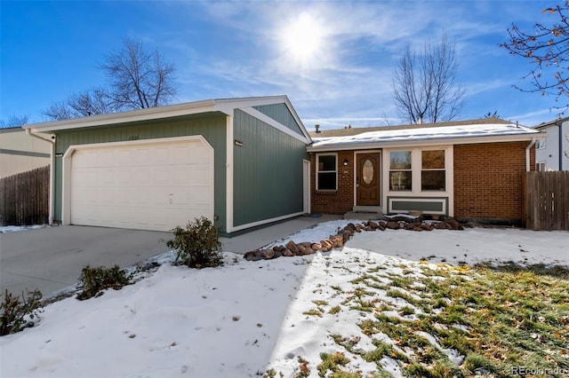 ranch-style house featuring a garage