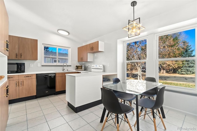 kitchen featuring pendant lighting, sink, light tile patterned floors, lofted ceiling, and black appliances