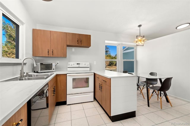 kitchen featuring sink, white range with electric cooktop, hanging light fixtures, black dishwasher, and kitchen peninsula