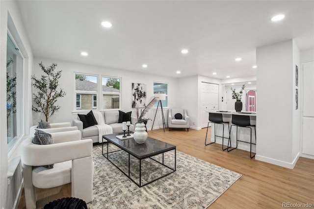 5515 Dudley Ct, Arvada, CO 80002 - living room featuring recessed lighting, light wood-style flooring, and baseboards