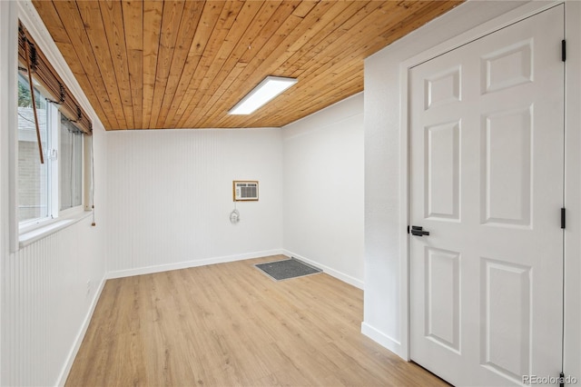 5515 Dudley Ct, Arvada, CO 80002 - laundry area featuring wood ceiling, light wood-style floors, and an AC wall unit