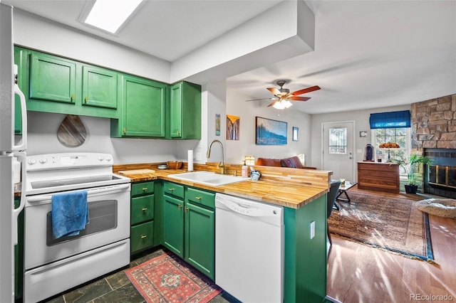 kitchen featuring white appliances and green cabinetry