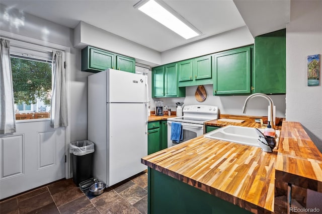 kitchen with green cabinets, sink, wooden counters, and white appliances