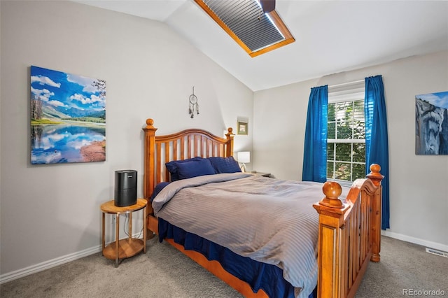 carpeted bedroom with vaulted ceiling