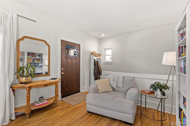 sitting room with hardwood / wood-style floors