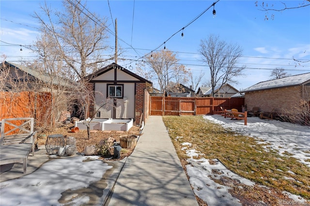 yard layered in snow with an outdoor structure