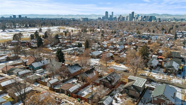 birds eye view of property with a mountain view