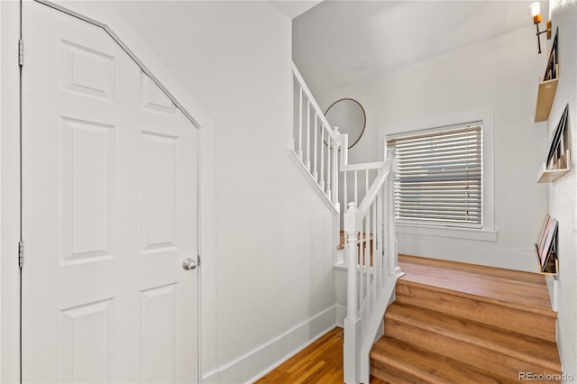 staircase featuring hardwood / wood-style floors