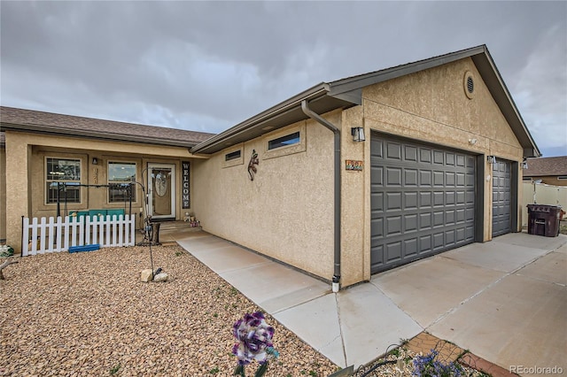 view of side of home featuring a garage