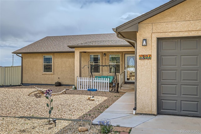 doorway to property featuring a garage