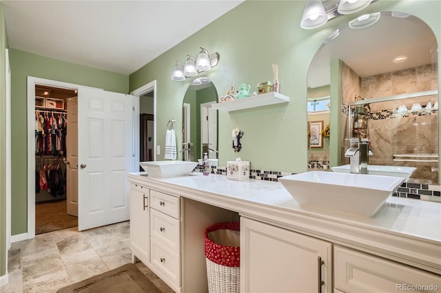 bathroom with vanity and an enclosed shower