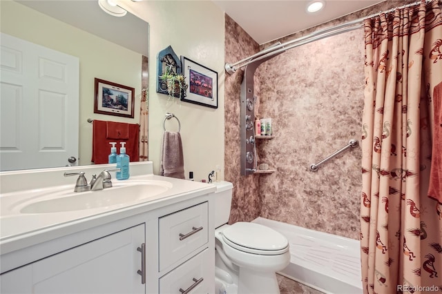 bathroom with a shower with curtain, vanity, and toilet