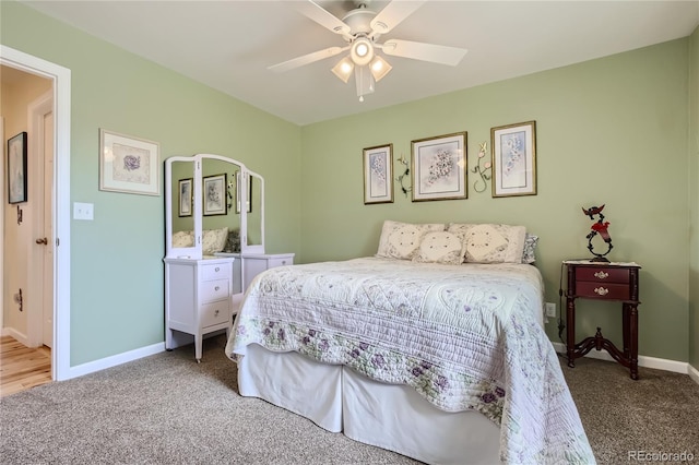 bedroom with ceiling fan and carpet floors