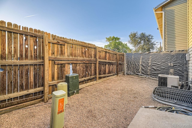 view of yard featuring central air condition unit