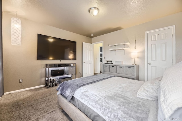 carpeted bedroom with a textured ceiling