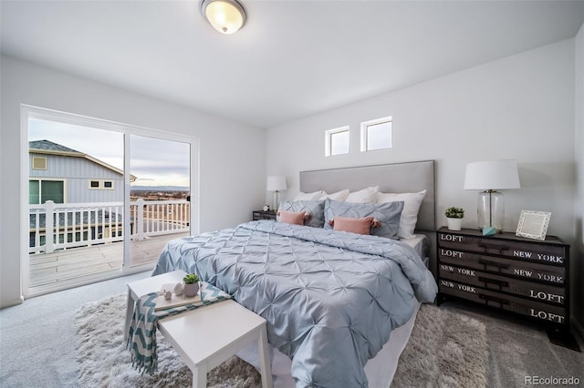 carpeted bedroom with access to outside