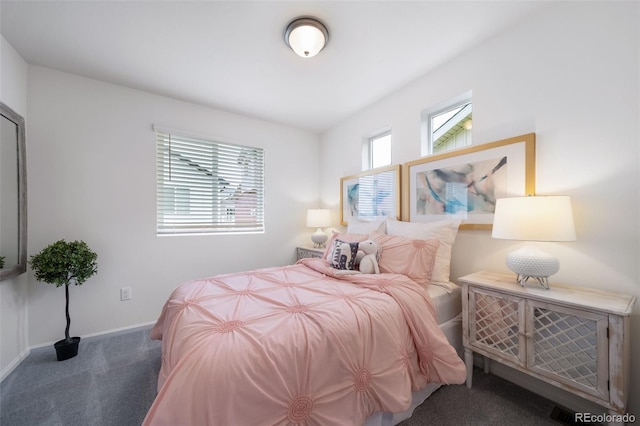 bedroom featuring dark carpet