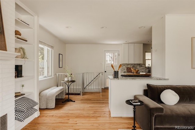 interior space featuring light wood-style floors and recessed lighting