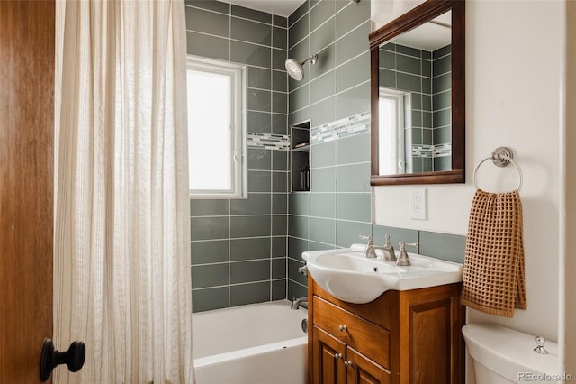 full bathroom featuring vanity, shower / bath combination with curtain, and toilet
