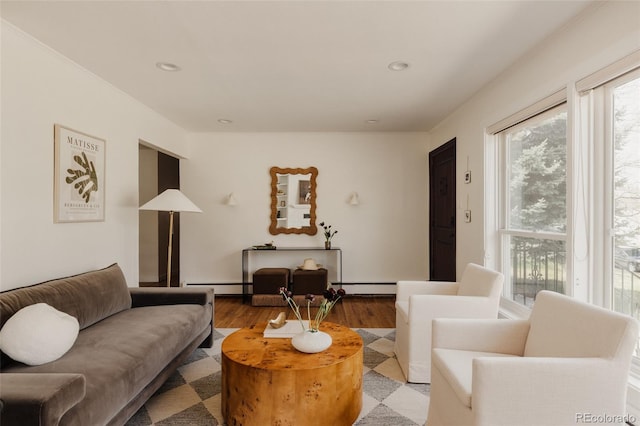 5700 E Floyd Ave, Denver, CO 80222 - living room with healthy amount of natural light, a baseboard radiator, light wood-type flooring, and recessed lighting