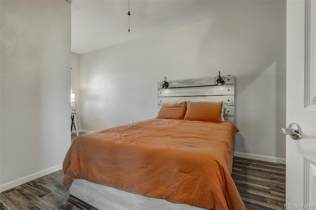 bedroom with dark hardwood / wood-style floors