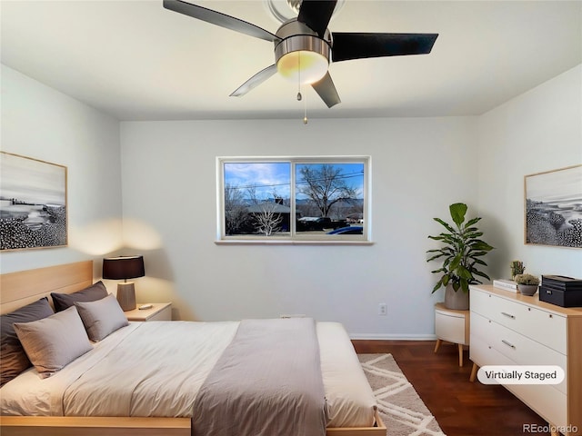 bedroom featuring ceiling fan, dark wood finished floors, and baseboards