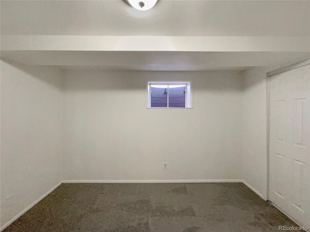 basement with carpet flooring and baseboards