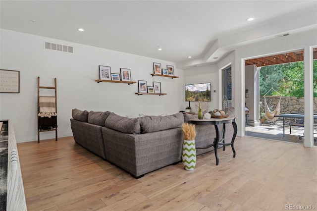 living room with light hardwood / wood-style floors