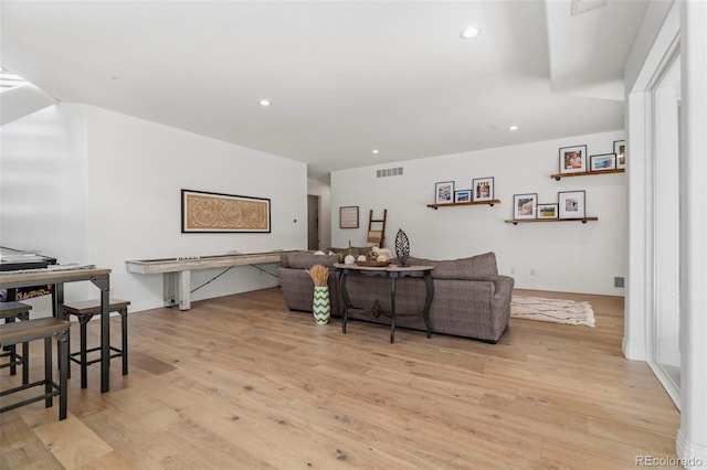 living room with light hardwood / wood-style floors