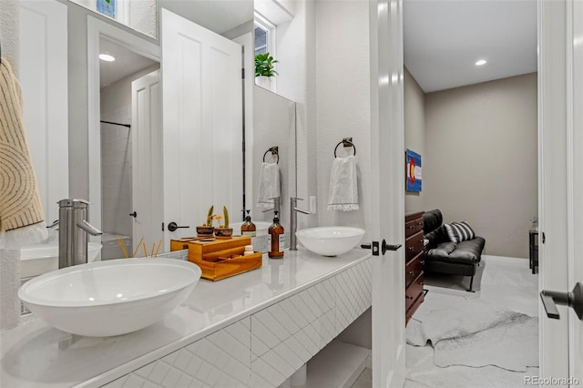 bathroom with plenty of natural light, independent shower and bath, vanity, and tile patterned floors