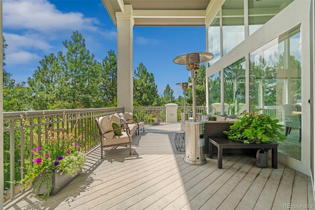 deck featuring outdoor lounge area