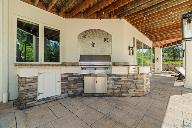 view of patio featuring exterior kitchen and area for grilling