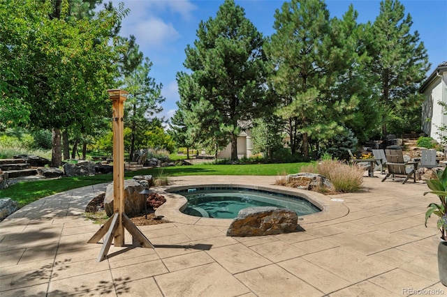 view of swimming pool featuring a patio area and a lawn