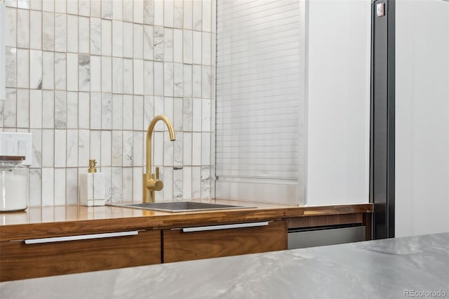 790 N Washington St Unit 407, Denver, CO 80203 - detailed view of decorative backsplash and stainless steel countertops