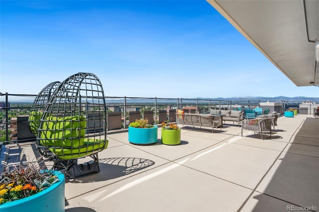 790 N Washington St Unit 407, Denver, CO 80203 - view of patio / terrace featuring an outdoor living space and a mountain view