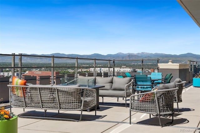 790 N Washington St Unit 407, Denver, CO 80203 - view of patio with a mountain view, an outdoor living space, and outdoor dining space
