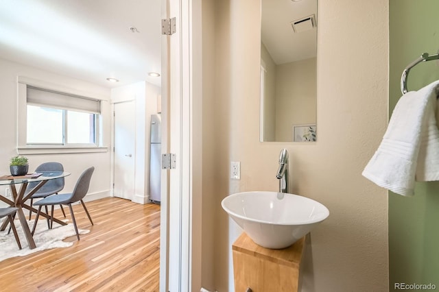 2837 Vallejo St Unit 102, Denver, CO 80211 - bathroom featuring a sink and wood finished floors