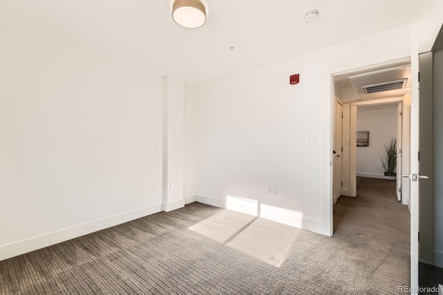 2837 Vallejo St Unit 102, Denver, CO 80211 - carpeted empty room with a smoke detector and baseboards