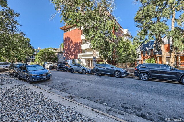 937 N Clarkson St Unit 206, Denver, CO 80218 - view of vehicle parking with a residential view