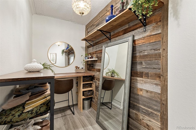 office space featuring light hardwood / wood-style flooring and a textured ceiling